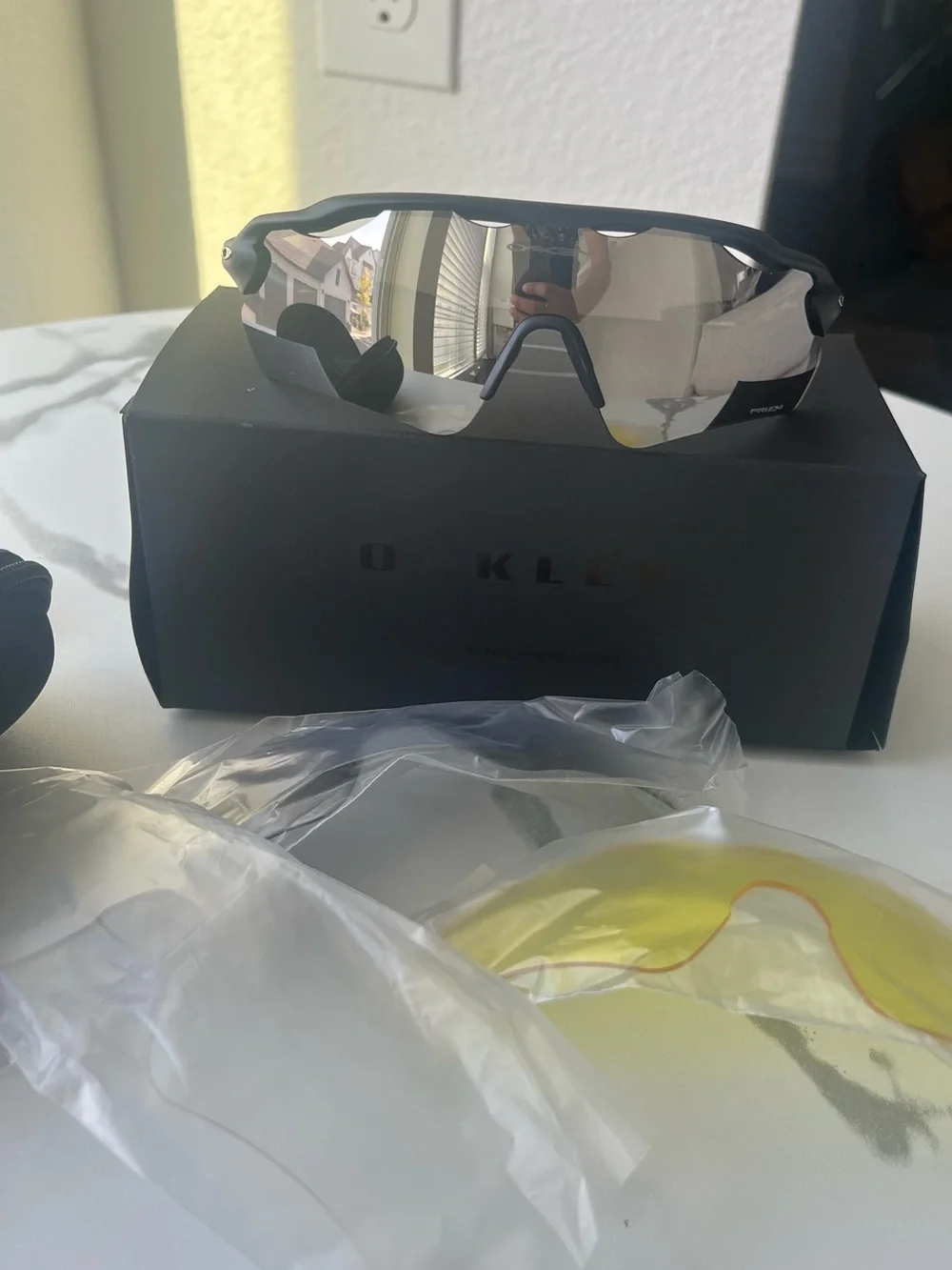 Oakley Black Frame Sunglasses with Silver Mirror Lens